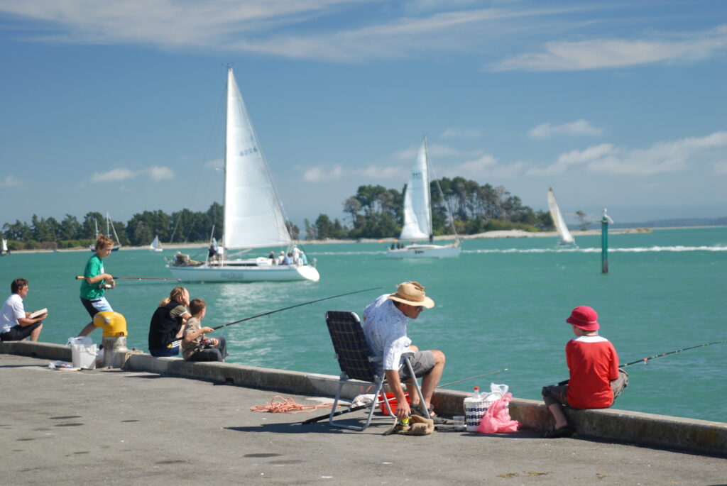 People fishing in Tahunanui, Nelson, New Zealand