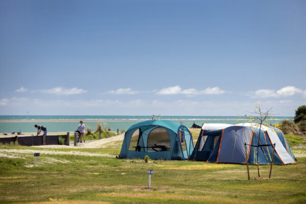 Two tents in the Green Zone of Tāhuna Beach Holiday Park. Picture by Tim Cuff 2024.